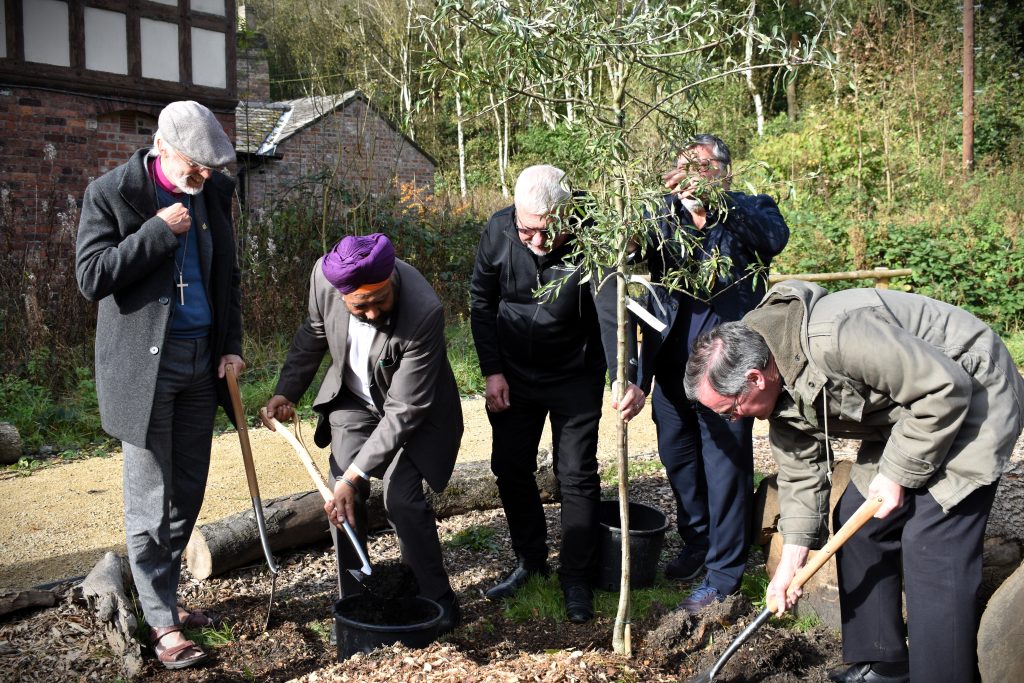 Photo of the interfaith leaders planting a weeping pear tree at the Laudato Si' Centre