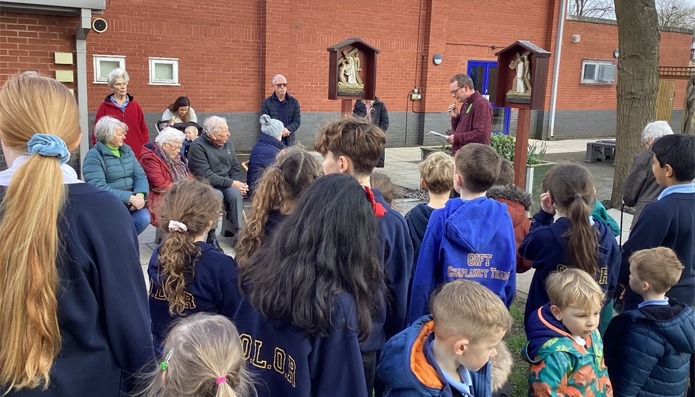 Parishioners and school children gather for Lenten Stations of the Cross