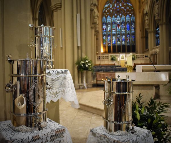 Photo of Holy Oils in front of the sanctuary of Salford Cathedral