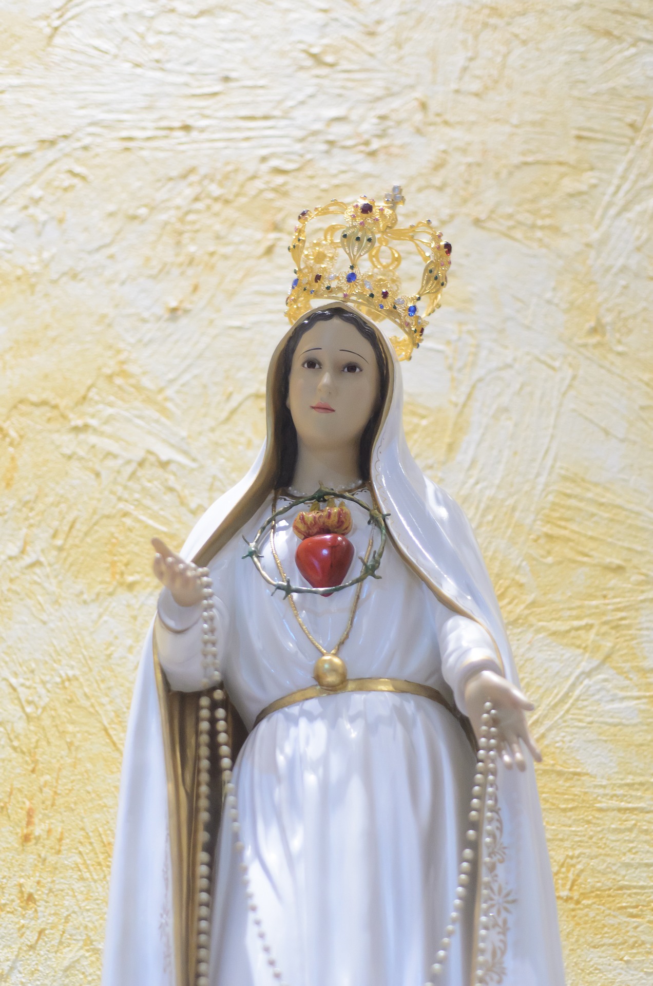 Statue of Our Lady of Fatima, displaying the bleeding Immaculate Heart surrounded by a Crown of Thorns